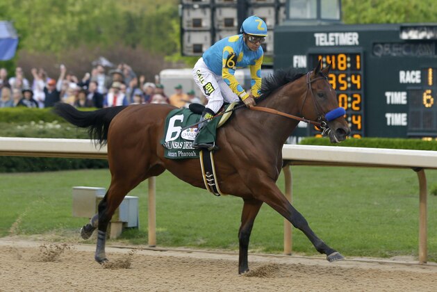Jockey Victor Espinoza leads American Pharoah to the finish to win the $1 million Arkansas Derby horse race at Oaklawn Park in Hot Springs, Ark., Saturday, April 11, 2015. (AP Photo/Danny Johnston) Jockey Victor Espinoza leads American Pharoah to the finish to win the $1 million Arkansas Derby horse race at Oaklawn Park in Hot Springs, Ark., Saturday, April 11, 2015. (AP Photo/Danny Johnston)