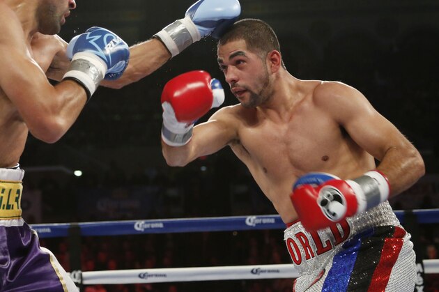 Sadam Ali of Brooklyn, N.Y. right, and Luis Carlos Abregu of Argentina fight during the ninth round of WBO Intercontinental Welterweight Title boxing in Atlantic City, N.J. on Saturday, Nov. 8, 2014. Ali won by TKO in the ninth round. (AP Photo/Tim Larsen)