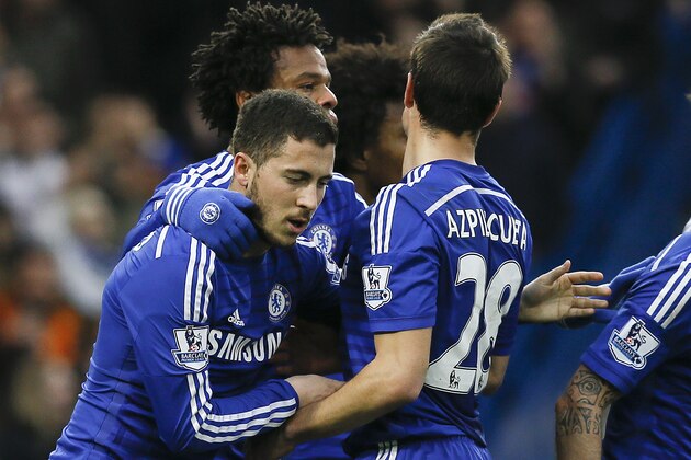 Chelsea's Eden Hazard, left, celebrates scoring a goal during the English Premier League soccer match between Chelsea and Stoke City at Stamford Bridge stadium in London, Saturday, April 4, 2015. (AP Photo/Kirsty Wigglesworth)