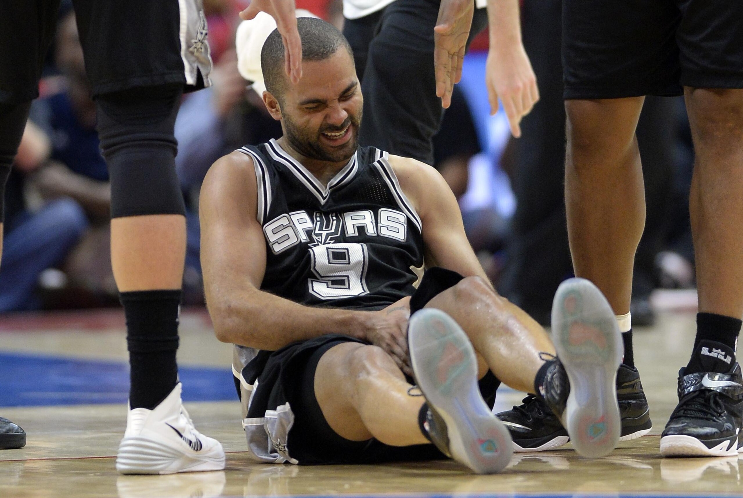 Apr 19, 2015; Los Angeles, CA, USA; San Antonio Spurs guard Tony Parker (9) reacts to an injury during the second quarter against the Los Angeles Clippers in game one of the first round of the NBA Playoffs at Staples Center. Mandatory Credit: Richard Mackson-USA TODAY Sports