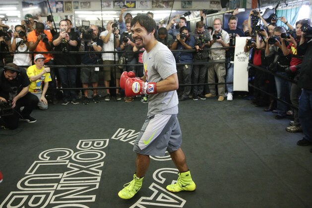 Boxer Manny Pacquiao, of the Philippines, smiles during a media workout at Wild Card Boxing Club, Wednesday, April 15, 2015, in Los Angeles. Pacquiao is scheduled to fight Floyd Mayweather Jr. in a welterweight boxing match in Las Vegas on May 2. (AP Photo/Jae C. Hong)