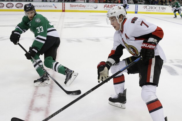 Ottawa Senators center Kyle Turris (7) skates for the puck against Dallas Stars defenseman Alex Goligoski (33) during the first period of an NHL hockey game Tuesday, Jan. 13, 2015, in Dallas. (AP Photo/LM Otero)