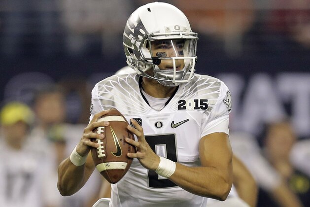 Oregon's Marcus Mariota during the first half of the NCAA college football playoff championship game against Ohio State Monday, Jan. 12, 2015, in Arlington, Texas. (AP Photo/Eric Gay)