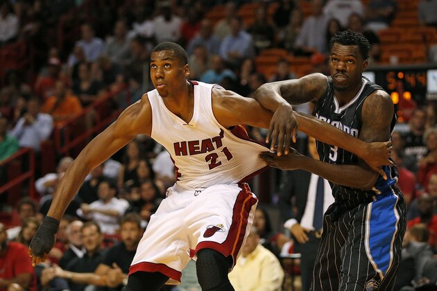 Orlando Magic’s Dewayne Dedmon (3) and Miami Heat's Hassan Whiteside (21) battle for position during the first half of an NBA basketball game, Monday, April 13, 2015, in Miami, Fla. Miami defeated Orlando 100-93. (AP Photo/Joel Auerbach)
