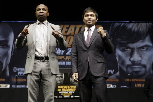 ADVANCE FOR WEEKEND EDITIONS, APRIL 25-26 - FILE - In this March 11, 2015, file photo, boxers Floyd Mayweather Jr., left, and Manny Pacquiao, of the Philippines, pose for photos after a news conference in Los Angeles. This is not Hagler-Hearns or Tyson vs. Anyone. Floyd Mayweather Jr. is the greatest defensive boxer in history, and Manny Pacquiao hasn't shown knockout power in a while. Expect this fight to go to the scorecards. (AP Photo/Jae C. Hong, File)