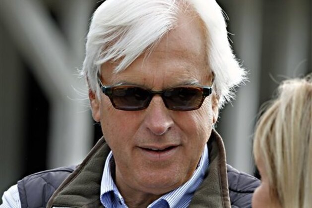 FILE - In this April 27, 2014, file photo, Hall of Fame horse racing trainer Bob Baffert listens to a question during an interview outside Barn 33 at Churchill Downs in Louisville, Ky. Baffert is holding a pretty strong hand heading into Kentucky Derby prep races the next few weeks, with the AP's top-rated Dortmund set for Saturday's San Felipe Stakes, and No. 3 American Pharoah scheduled for the Rebel Stakes on March 14.  (AP Photo/Garry Jones, File)