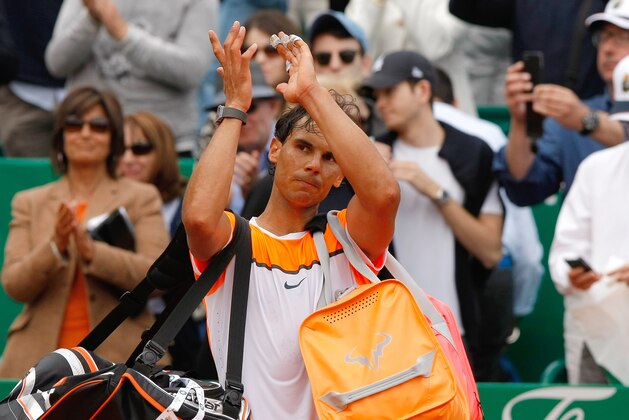 Rafael Nadal of Spain applauds his supporters after losing the semifinal match of the Monte Carlo Tennis Masters tournament against Novak Djokovic of Serbia, in Monaco, Saturday, April 18, 2015. (AP Photo/Claude Paris)