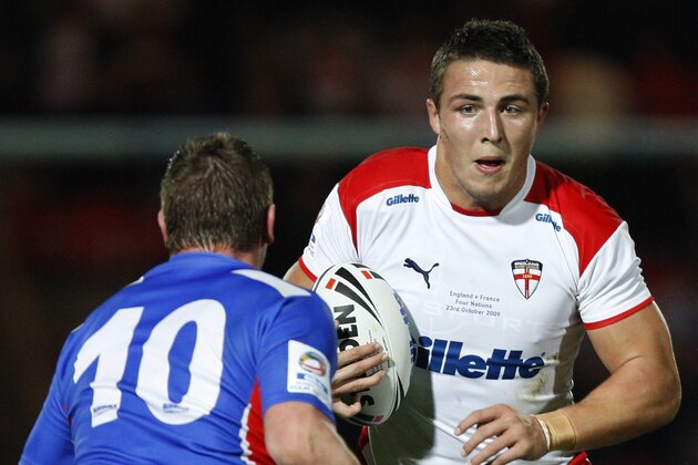 England's Sam Burgess, right, is tackled by France's Remi Casty during their Four Nations rugby league match at the Keepmoat Stadium, Doncaster, England, Friday Oct. 23, 2009. (AP Photo/Jon Super)