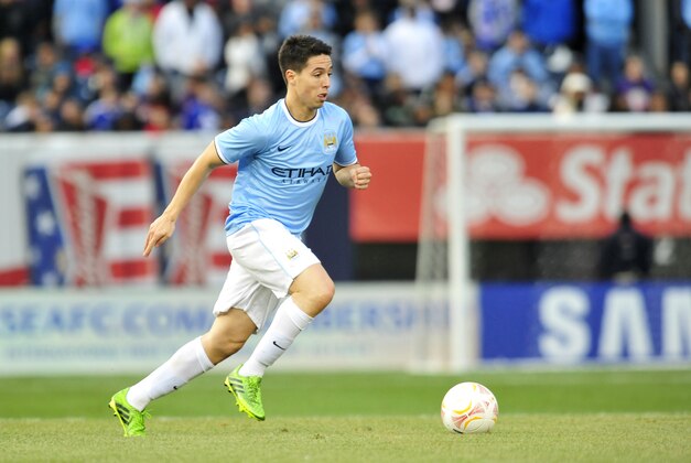 May 25, 2013; Bronx, NY, USA; Manchester City midfielder Samir Nasri (8) dribbles against Chelsea during the second half at Yankee Stadium. Manchester City won 5-3. Mandatory Credit: Joe Camporeale-USA TODAY Sports