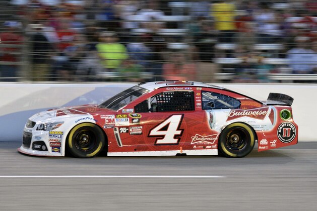 Kevin Harvick (4) competes during the NASCAR Sprint Cup auto race at Texas Motor Speedway in Fort Worth, Texas, Saturday, April 11, 2015. (AP Photo/Larry Papke)