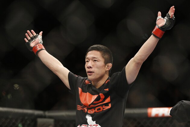 Kyoji Horiguchi celebrates after defeating Louis Gaudinot during their flyweight mixed martial arts bout at UFC 182, Saturday, Jan. 3, 2015, in Las Vegas. (AP Photo/John Locher)