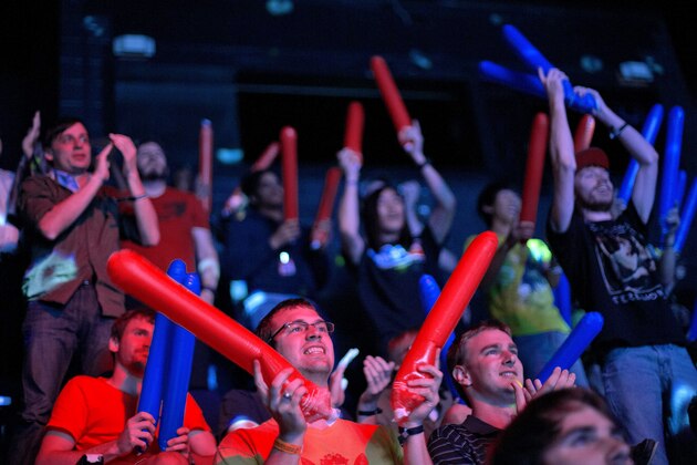 In this July 13, 2014 photo, spectators cheer after Choi