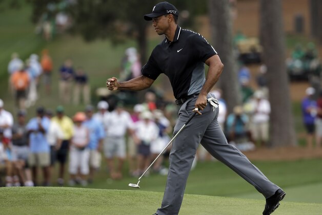 Tiger Woods pumps his fist after a birdie on the seventh hole during the second round of the Masters golf tournament Friday, April 10, 2015, in Augusta, Ga. (AP Photo/Matt Slocum)