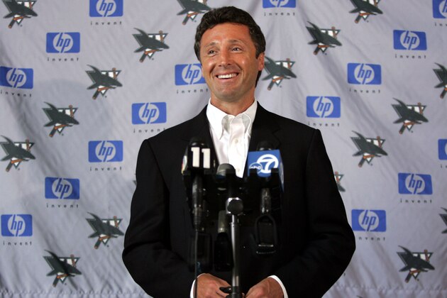 San Jose Sharks General Manager Doug Wilson smiles during a news conference in San Jose, Calif., Wednesday, July 13, 2005, as he talks about the possible end of the NHL lockout. After losing an entire season to a lockout, players and owners ended an all-night bargaining session Wednesday by reaching their goal: a tentative deal, expected to include a salary cap, that virtually ensures hockey will return this fall. (AP Photo/Paul Sakuma)