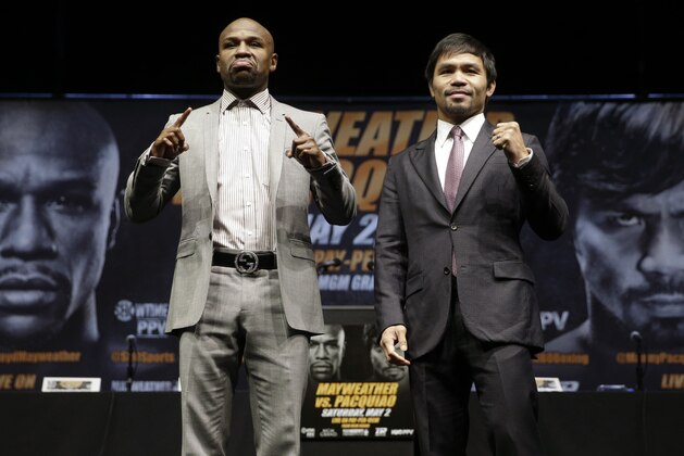 ADVANCE FOR WEEKEND EDITIONS, APRIL 25-26 - FILE - In this March 11, 2015, file photo, boxers Floyd Mayweather Jr., left, and Manny Pacquiao, of the Philippines, pose for photos after a news conference in Los Angeles. This is not Hagler-Hearns or Tyson vs. Anyone. Floyd Mayweather Jr. is the greatest defensive boxer in history, and Manny Pacquiao hasn't shown knockout power in a while. Expect this fight to go to the scorecards. (AP Photo/Jae C. Hong, File) ADVANCE FOR WEEKEND EDITIONS, APRIL 25-26 - FILE - In this March 11, 2015, file photo, boxers Floyd Mayweather Jr., left, and Manny Pacquiao, of the Philippines, pose for photos after a news conference in Los Angeles. This is not Hagler-Hearns or Tyson vs. Anyone. Floyd Mayweather Jr. is the greatest defensive boxer in history, and Manny Pacquiao hasn't shown knockout power in a while. Expect this fight to go to the scorecards. (AP Photo/Jae C. Hong, File)