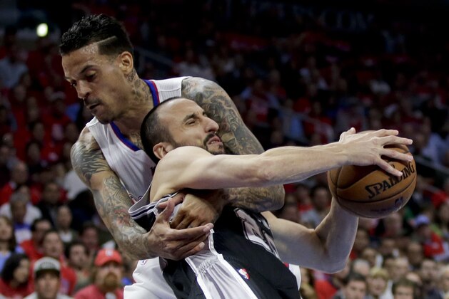 Los Angeles Clippers forward Matt Barnes, left, fouls San Antonio Spurs guard Manu Ginobili during the first half of Game 2 of a first-round NBA basketball playoff series in Los Angeles, Wednesday, April 22, 2015. (AP Photo/Chris Carlson)