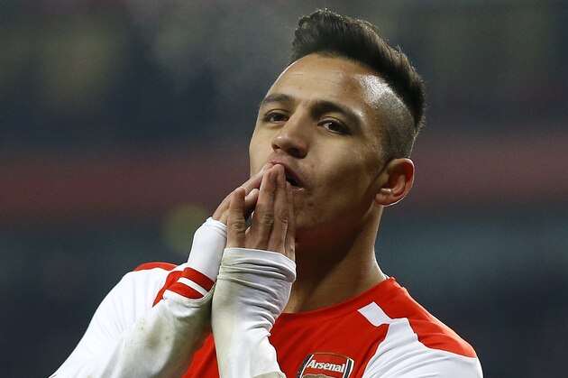 Arsenal's Alexis Sanchez holds up his hands after a missed opportunity during the English FA Cup third round soccer match between Arsenal and Hull City at the Emirates Stadium in London, Sunday, Jan. 4, 2015. (AP Photo/Kirsty Wigglesworth)
