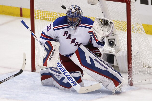 New York Rangers goalie Henrik Lundqvist (30) blocks a shot during the first inning of a first-round NHL playoff hockey game against the Pittsburgh Penguins in Pittsburgh Wednesday, April 22, 2015.(AP Photo/Gene J. Puskar)