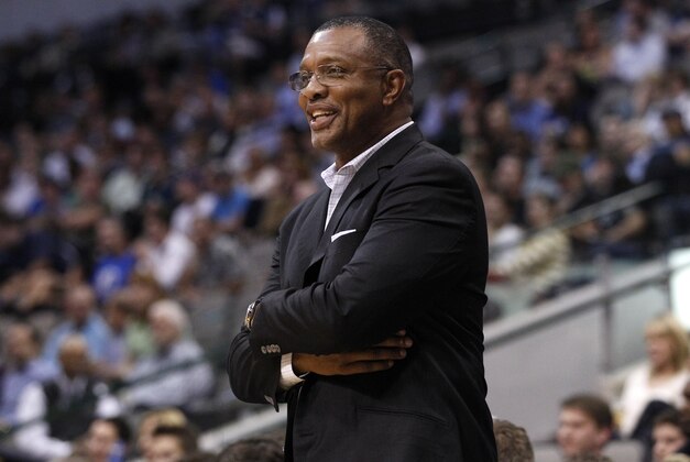 Alvin Gentry smile as he watches the preseason action in an NBA basketball game against the Dallas Mavericks Wednesday, Oct. 17, 2012, in Dallas. The Suns defeated the Mavericks 100-94. (AP Photo/Tony Gutierrez)