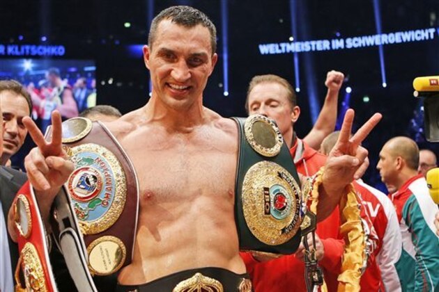 IBF, WBA, WBO and IBO champion Wladimir Klitschko from Ukraine,  celebrates after winning the IBF heavyweight world championships title bout against Bulgarian boxer Kubrat Pulev in Hamburg, Germany, Saturday, Nov. 15,  2014.(AP Photo/Frank Augstein)