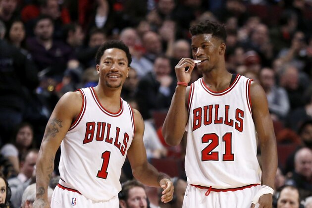 Chicago Bulls guard Derrick Rose (1) and Jimmy Butler (21) talk during the second half of an NBA basketball game against the Milwaukee Bucks, Monday, Feb. 23, 2015, in Chicago. The Bulls won 87-71. (AP Photo/Charles Rex Arbogast)