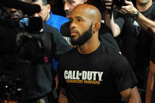 Sep 27, 2014; Las Vegas, NV, USA; Demetrious Johnson walks towards the octagon before he defends his featherweight title against Chris Cariaso during UFC 178 at MGM Grand Garden Arena. Mandatory Credit: Stephen R. Sylvanie-USA TODAY Sports