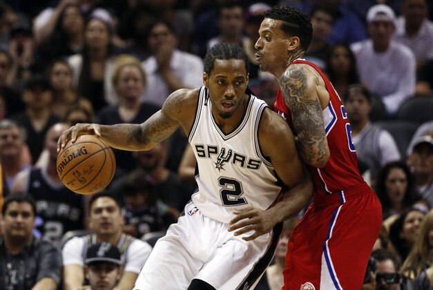 Apr 24, 2015; San Antonio, TX, USA; San Antonio Spurs small forward Kawhi Leonard (2) posts up against Los Angeles Clippers small forward Matt Barnes (R) in game three of the first round of the NBA Playoffs at AT&T Center. Mandatory Credit: Soobum Im-USA TODAY Sports