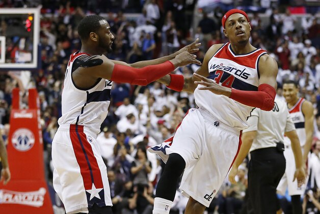 Apr 24, 2015; Washington, DC, USA; Washington Wizards guard John Wall (2) celebrates with Wizards forward Paul Pierce (34) against the Toronto Raptors in the fourth quarter in game three of the first round of the NBA Playoffs at Verizon Center. The Wizards won 106-99, and lead the series 3-0. Mandatory Credit: Geoff Burke-USA TODAY Sports