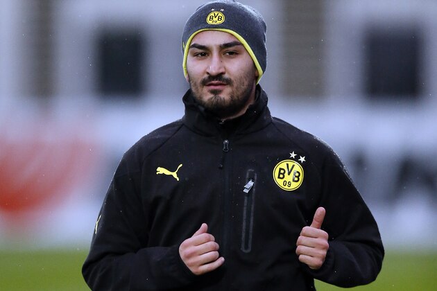 Dortmund's Ilkay Gundogan warms up during a training session one day ahead the Champions League group F soccer match between Borussia Dortmund and Arsenal FC in Dortmund, Germany, Tuesday, Nov. 5, 2013. (AP Photo/Frank Augstein)