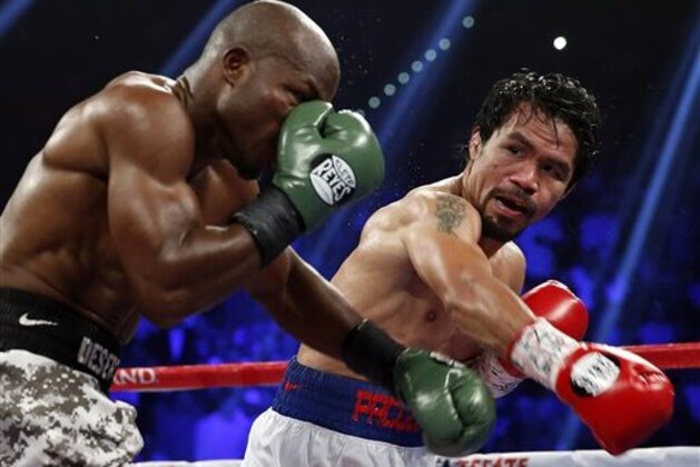 ADVANCE FOR WEEKEND EDITIONS, APRIL 25-26 - FILE - In this April 12, 2014 file,photo, Manny Pacquiao, right, of the Philippines, trades blows with Timothy Bradley, in their WBO welterweight title boxing match in Las Vegas. This is not Hagler-Hearns or Tyson vs. Anyone. Floyd Mayweather Jr. is the greatest defensive boxer in history, and Manny Pacquiao hasn't shown knockout power in a while. Expect this fight to go to the scorecards. (AP Photo/Isaac Brekken)