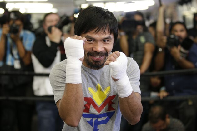 Boxer Manny Pacquiao, of the Philippines, shadow-boxes during a media workout at Wild Card Boxing Club, Wednesday, April 15, 2015, in Los Angeles. Pacquiao is scheduled to fight Floyd Mayweather Jr. in a welterweight boxing match in Las Vegas on May 2. (AP Photo/Jae C. Hong)