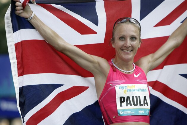 Paula Radcliffe, of England, holds up her country's flag after winning the New York City Half Marathon in New York, Sunday, Aug. 16, 2009.  (AP Photo/Seth Wenig)