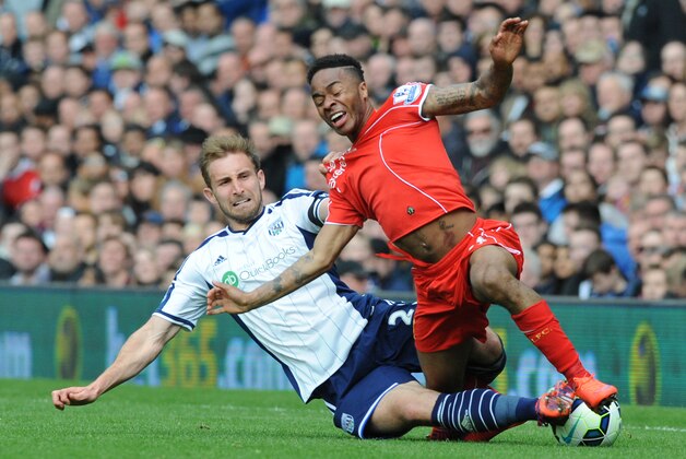 Liverpool's Raheem Sterling, right, is tackled by West Brom's Craig Dawson during the English Premier League soccer match between West Bromwich Albion and Liverpool at the Hawthorns, West Bromwich, England, Saturday, April 25, 2015. (AP Photo/Rui Vieira)