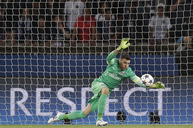 PSG goalkeeper Salvatore Sirigu makes a save during the quarterfinal first leg Champions League soccer match between Paris Saint Germain and Barcelona at the Parc des Princes stadium in Paris, France, Wednesday, April 15, 2015. (AP Photo/Christophe Ena)