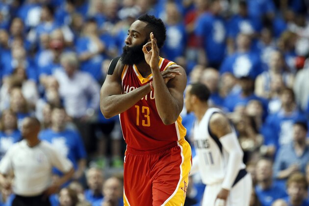 Houston Rockets' James Harden (13) celebrates after sinking a 3-point basket in the second half of Game 3 in an NBA basketball first-round playoff series against the Dallas Mavericks, Friday, April 24, 2015, in Dallas. The Rockets won 130-128. (AP Photo/Tony Gutierrez)
