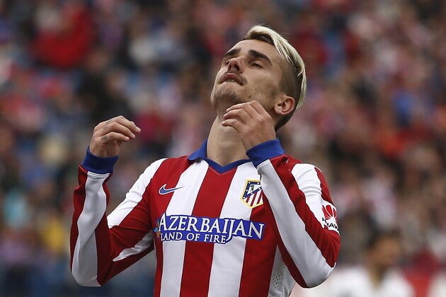 Atletico's Antoine Griezmann gestures during a Spanish La Liga soccer match between Atletico Madrid and Elche at the Vicente Calderon stadium in Madrid, Spain, Saturday, April 25, 2015. (AP Photo/Andres Kudacki)