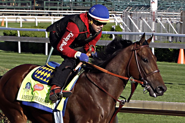 Kentucky Derby hopeful American Pharoah gallops under exercise rider Jorge Alvarez at Churchill Downs in Louisville, Ky., Thursday, April 23, 2015.  (AP Photo/Garry Jones)