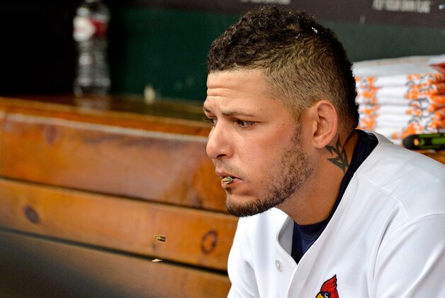Apr 13, 2015; St. Louis, MO, USA; St. Louis Cardinals catcher Yadier Molina (4) spits sunflower seeds in the dugout during the game between the St. Louis Cardinals and the Milwaukee Brewers at Busch Stadium. Mandatory Credit: Jasen Vinlove-USA TODAY Sports