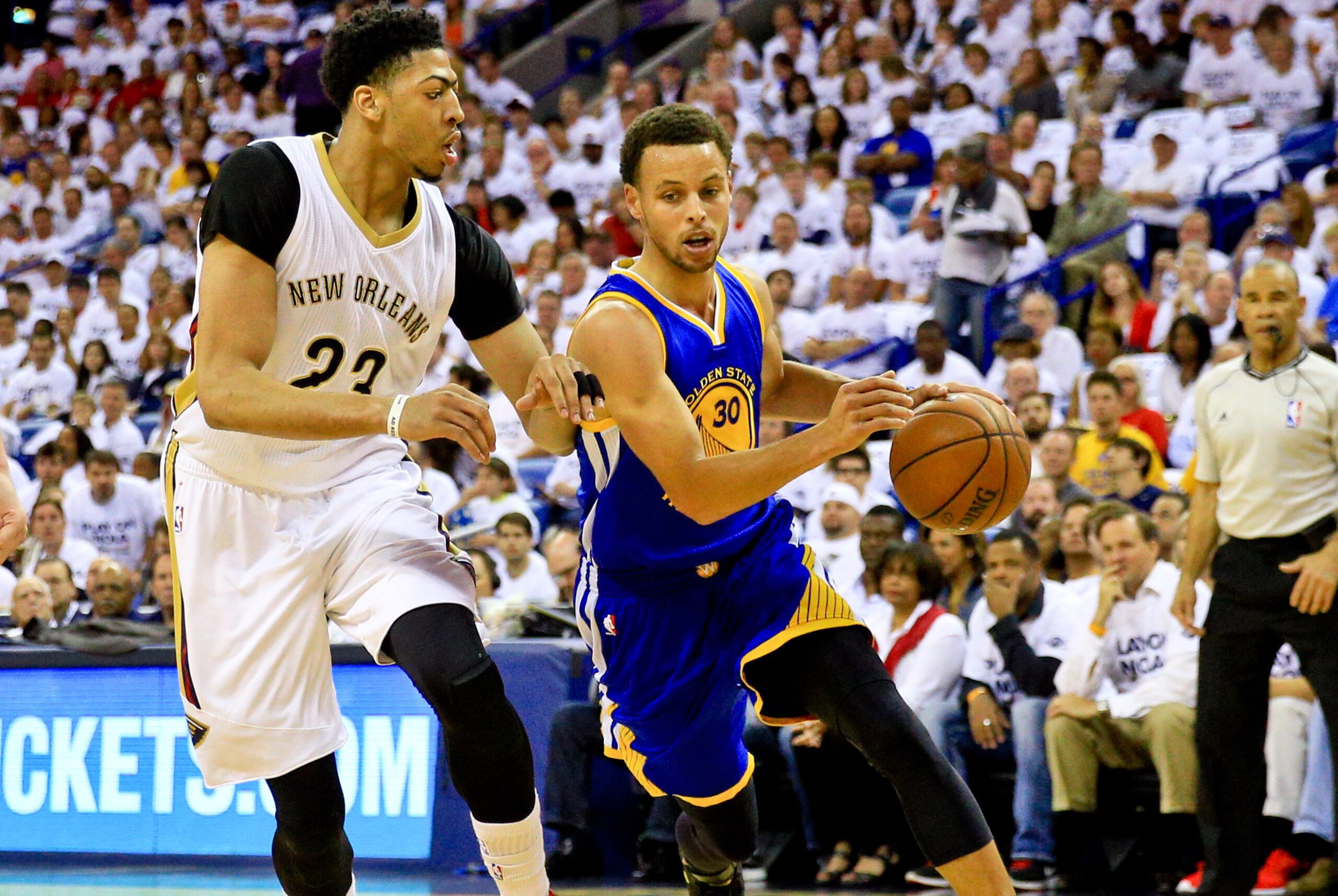 Apr 25, 2015; New Orleans, LA, USA; Golden State Warriors guard Stephen Curry (30) drives past New Orleans Pelicans forward Anthony Davis (23) during the first quarter in game four of the first round of the NBA Playoffs at the Smoothie King Center. Mandatory Credit: Derick E. Hingle-USA TODAY Sports