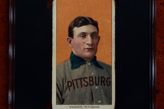 A 1909 Honus Wagner baseball card, one of the most sought-after sports collectibles in the world, is seen in a protective case Monday, March 26, 2012, in Sunset Hills, Mo. Bill Goodwin, who will facilitate an online auction starting on Tuesday for the card, expects it to fetch at least $1 million and perhaps as much as $1.5 million. (AP Photo/Jeff Roberson)
