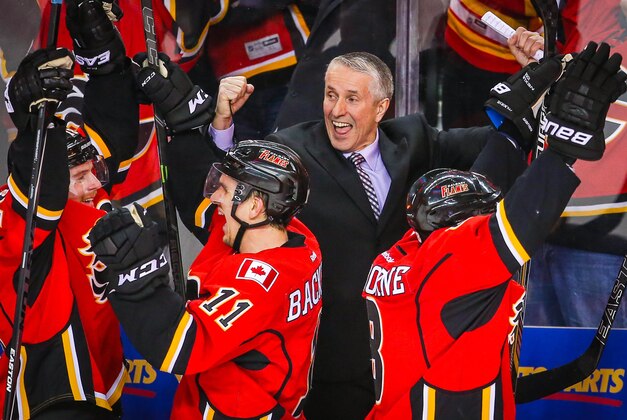 Apr 25, 2015; Calgary, Alberta, CAN; Calgary Flames head coach Bob Hartley celebrates goal by Calgary Flames left wing Jiri Hudler (not pictured) during the third period in game six of the first round of the 2015 Stanley Cup Playoffs at Scotiabank Saddledome. Calgary Flames won 7-4. Mandatory Credit: Sergei Belski-USA TODAY Sports