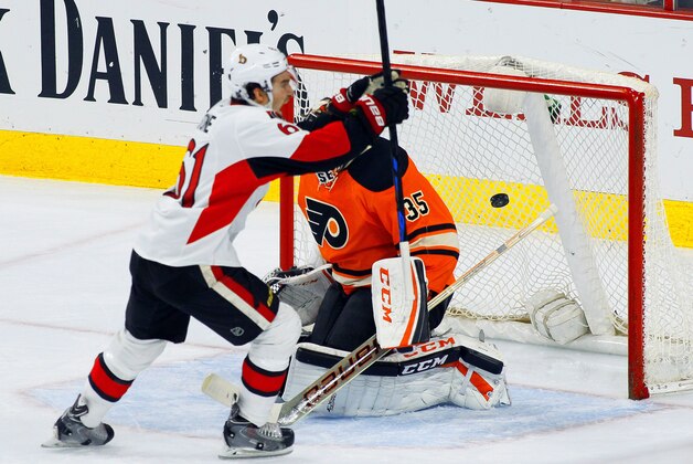 Ottawa Senators' Mark Stone reacts after scoring against Philadelphia Flyers goalie Steve Mason in the third period of an NHL hockey game, Saturday, April 11, 2015, in Philadelphia. The Senators won 3-1.(AP Photo/Tom Mihalek)