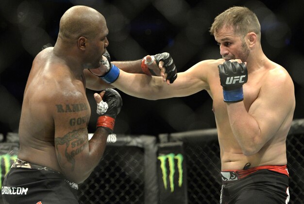 Apr 25, 2015; Montreal, Quebec, CAN; Rampage Jackson (red) and Fabio Maldonado (blue) fight during their catchweight bout during UFC 186 at Bell Centre. Mandatory Credit: Eric Bolte-USA TODAY Sports