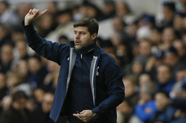 Tottenham's manager Mauricio Pochettino directs his team during the English Premier League soccer match between Tottenham Hotspur and Crystal Palace at White Hart Lane stadium in London, Saturday, Dec. 6, 2014. (AP Photo/Kirsty Wigglesworth)