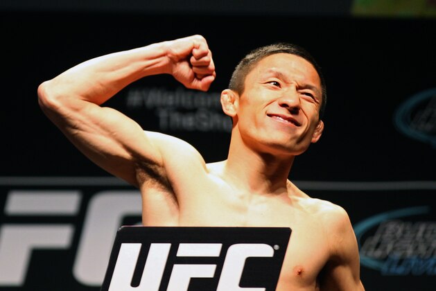 Apr 24, 2015; Montreal, Quebec, CAN; Kyoji Horiguchi stands on the scale during weigh-ins for UFC 186 at Metropolis. Mandatory Credit: Jean-Yves Ahern-USA TODAY Sports
