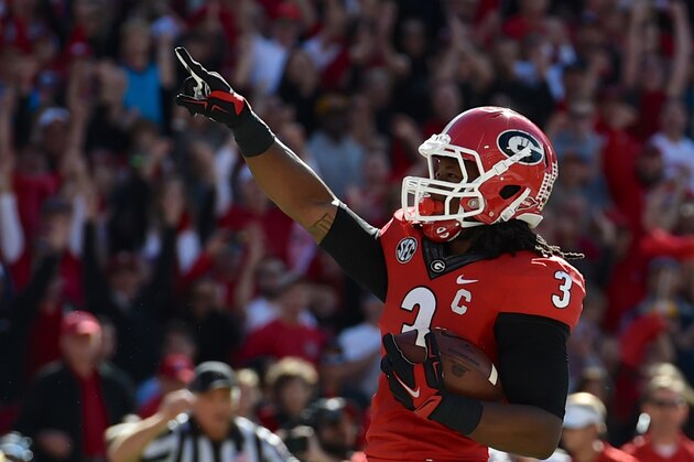 Oct 4, 2014; Athens, GA, USA; Georgia Bulldogs running back Todd Gurley (3) reacts after scoring a touchdown against the  Vanderbilt Commodores defensive lineman Jay Woods (74) during the first half at Sanford Stadium. Mandatory Credit: Dale Zanine-USA TODAY Sports