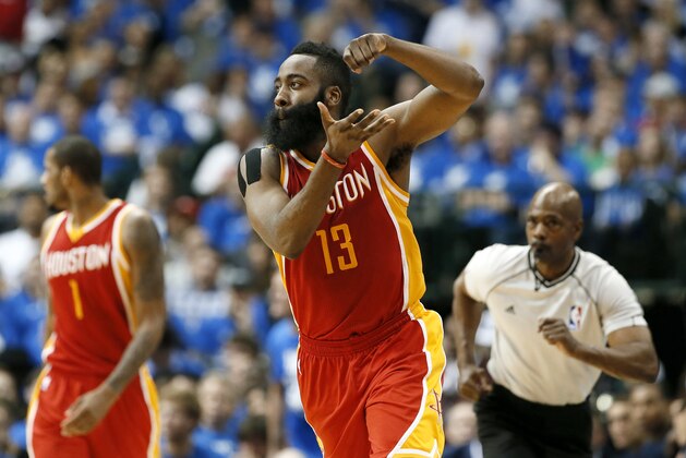 Houston Rockets' James Harden (13) celebrates after sinking a3-point basket against the Dallas Mavericks in the second half of Game 3 in an NBA basketball first-round playoff series Friday, April 24, 2015, in Dallas. The Rockets won 130-128. (AP Photo/Tony Gutierrez)