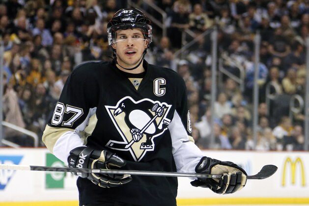 Pittsburgh Penguins center Sidney Crosby (87) prepares to take a face-off during the second period of a first-round NHL playoff hockey game against the New York Rangers in Pittsburgh Monday, April 20, 2015. The Rangers won 2-1. (AP Photo/Gene J. Puskar)