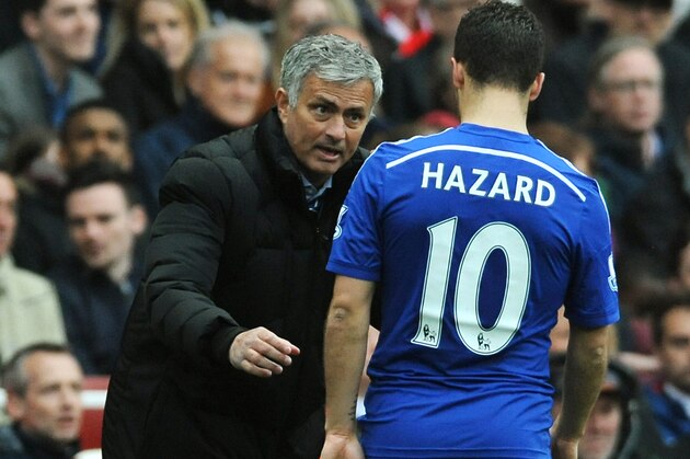 Chelsea manager Jose Mourinho speaks to his player Eden Hazard during the English Premier League soccer match between Arsenal and Chelsea at the Emirates Stadium, London, England, Sunday, April 26, 2015. (AP Photo/Rui Vieira)