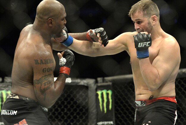 Apr 25, 2015; Montreal, Quebec, CAN; Rampage Jackson (red) and Fabio Maldonado (blue) fight during their catchweight bout during UFC 186 at Bell Centre. Mandatory Credit: Eric Bolte-USA TODAY Sports